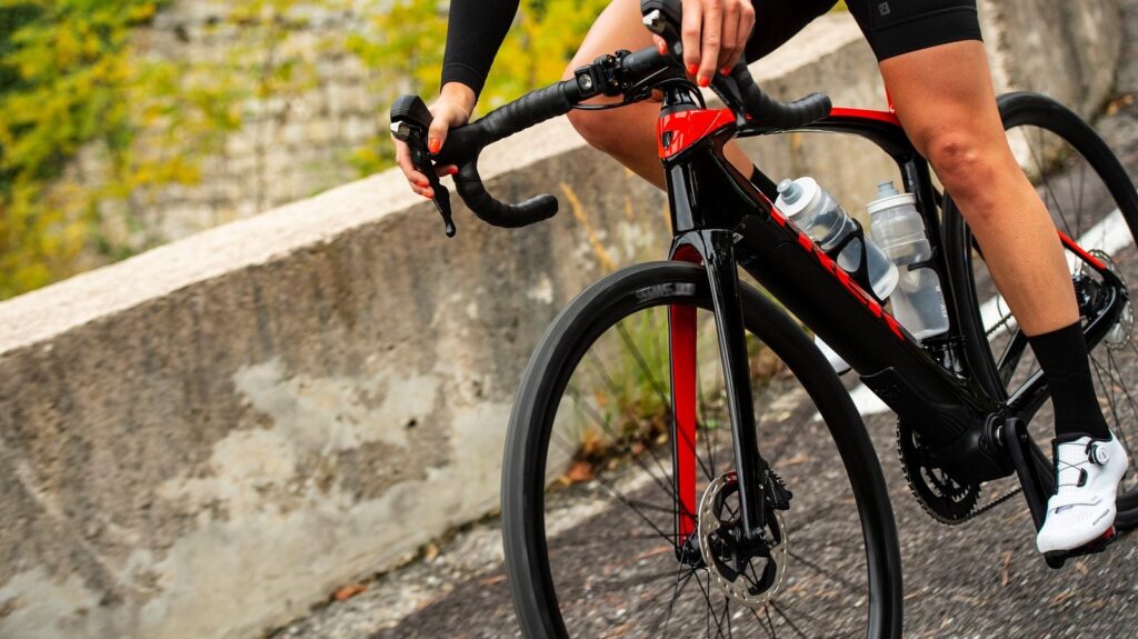 close up of a red and black Trek Domane plus bike