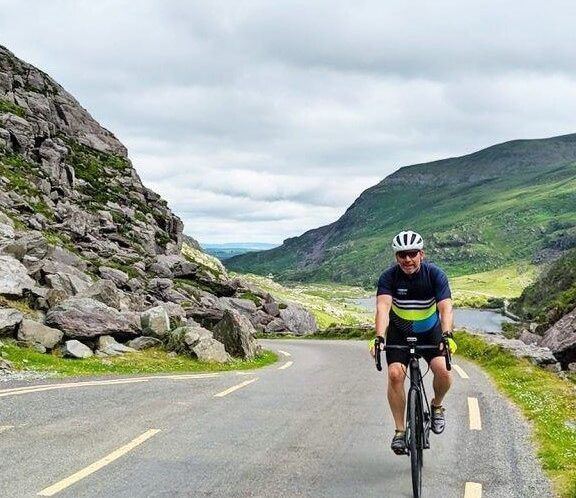 Lone rider summits a mountain pass