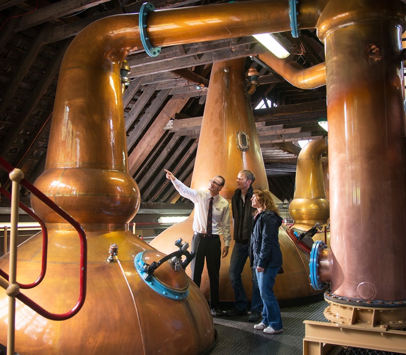 People on a tour of whisky distillery