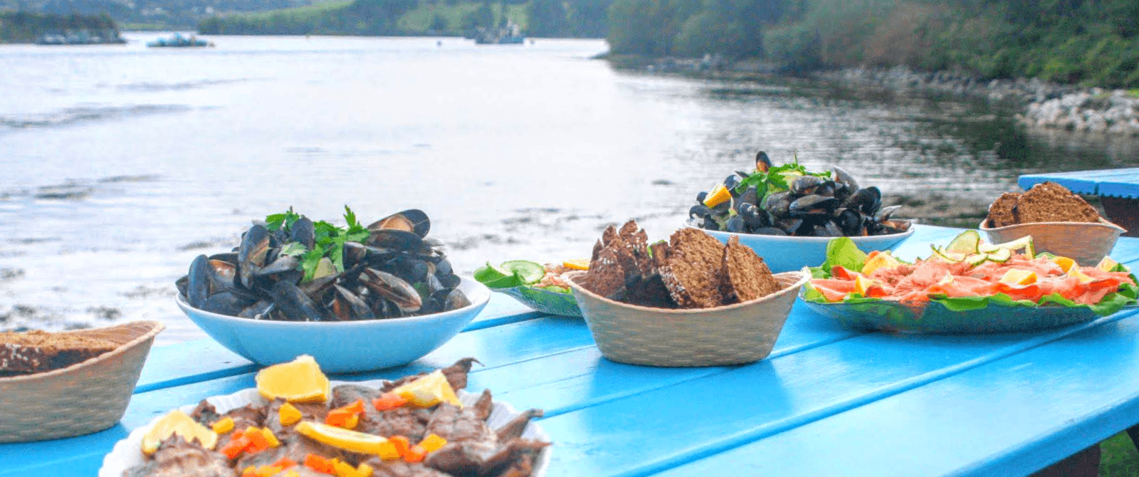 food set out on a blue picnic table