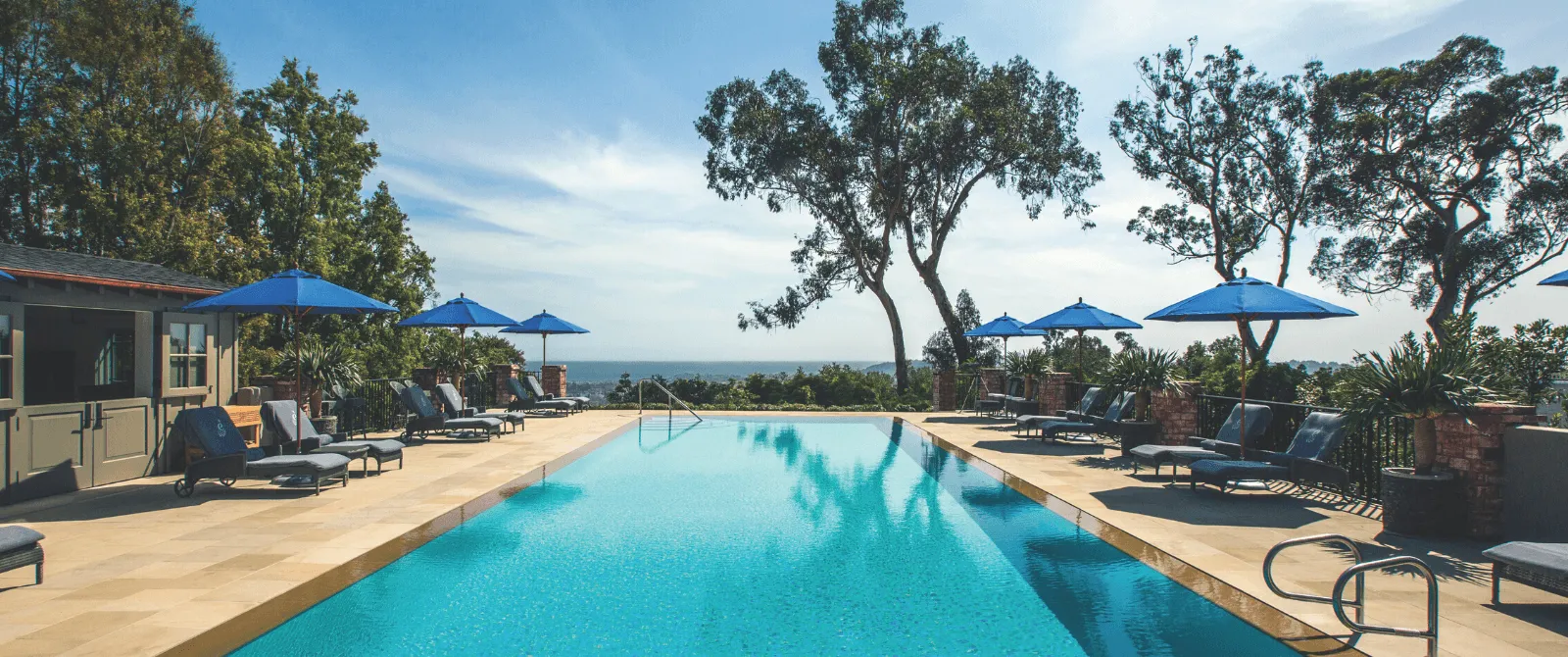 Infinity pool and lounge chairs at the Belmond hotel