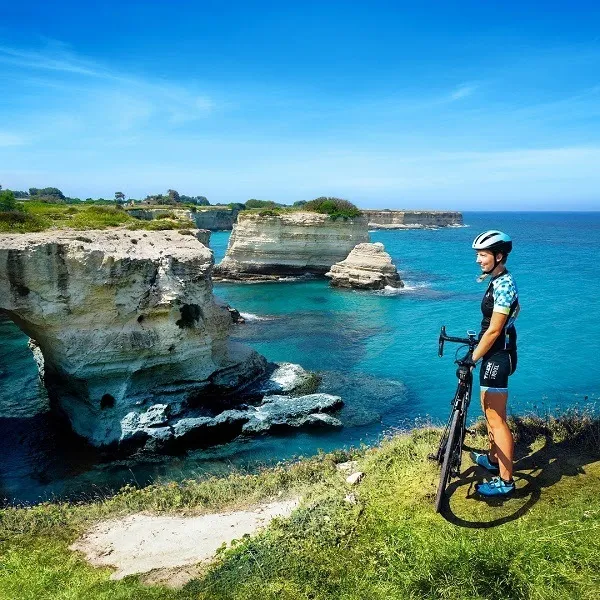 Person stands by sea in Puglia