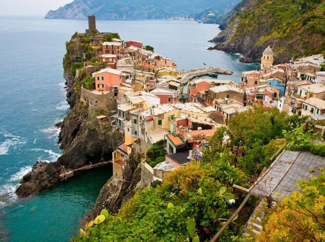 Cliffs with houses overlooking the ocean in Italy