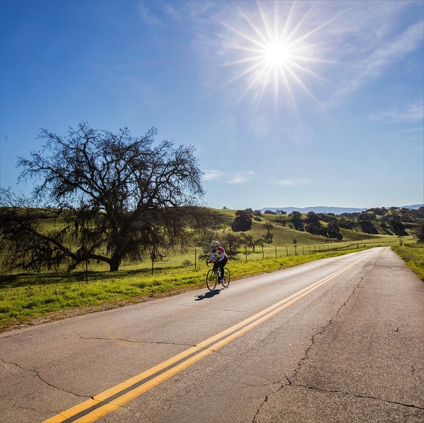 person riding their bike on a sunny day in Solvang, California