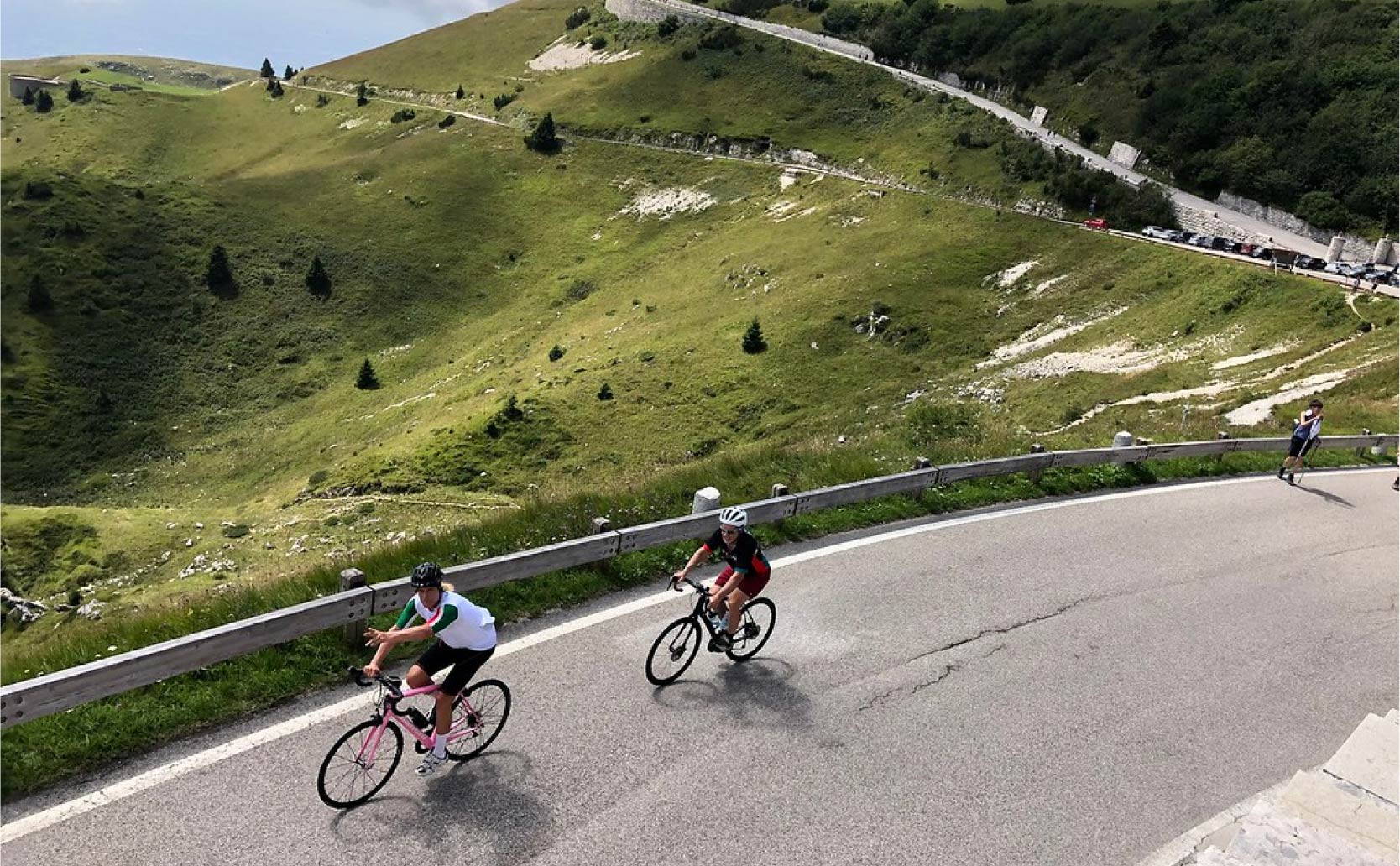 Two cyclist wind their way uphill