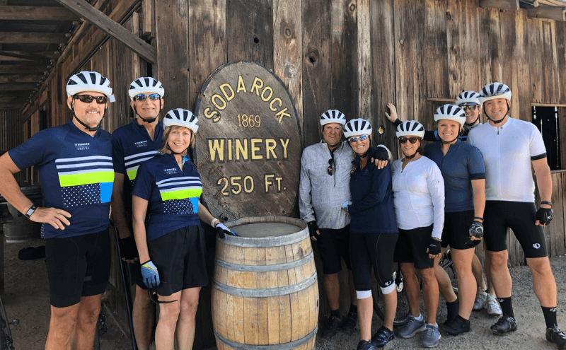 Group in front of the Soda Rock winery sign