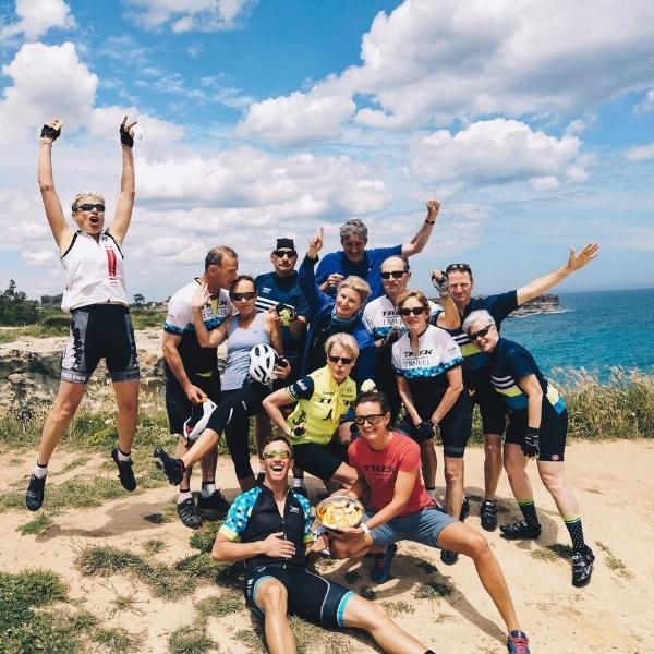 A group of cyclists pose for a photo by the Adriatic Sea