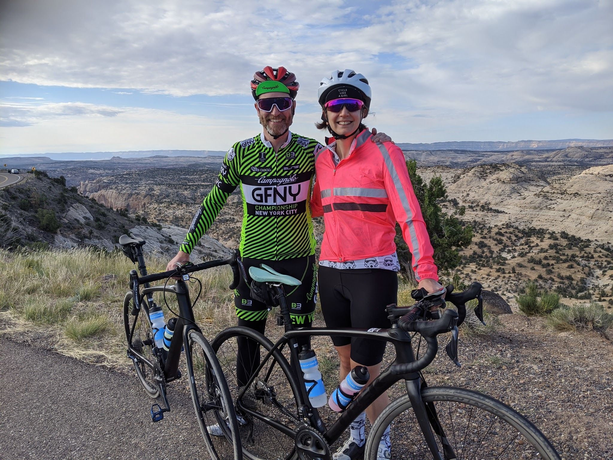 two cyclists posing with their bikes at Bryce and Zion National Park