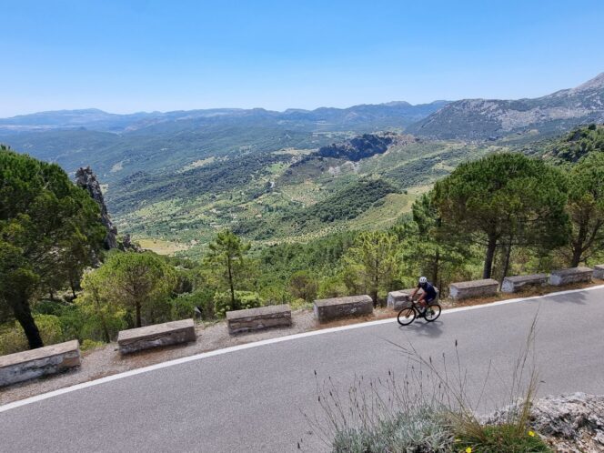 person cycling with beautiful mountain view in Andalucia Spain