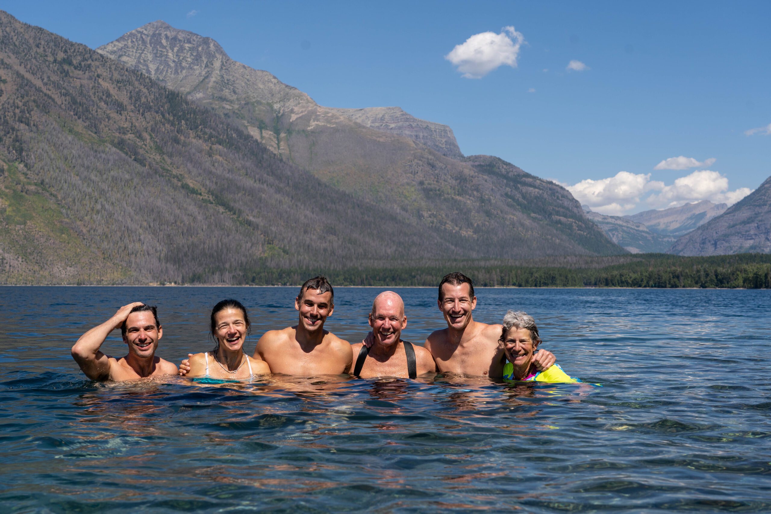 Trek Travel group swims in Lake McDonald