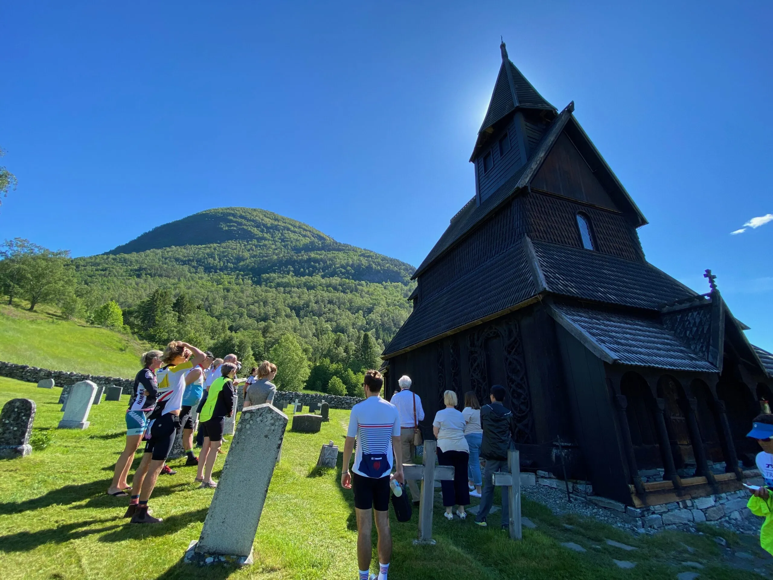 Group of people looking at a Stave Church