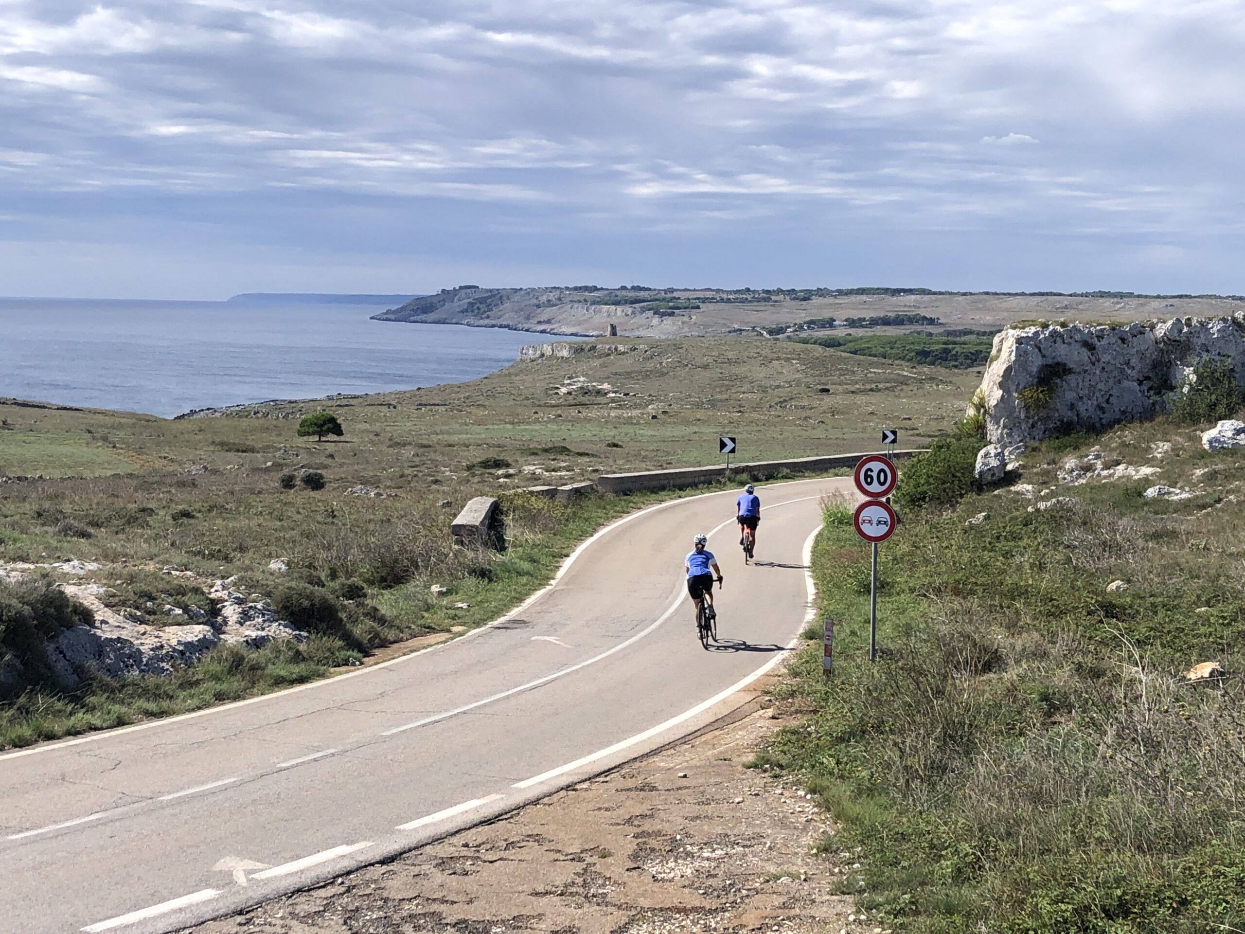 Two cyclists ride the Italian coastline in Puglia