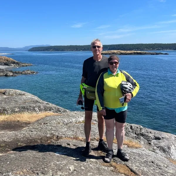 Couple standing in front of ocean view