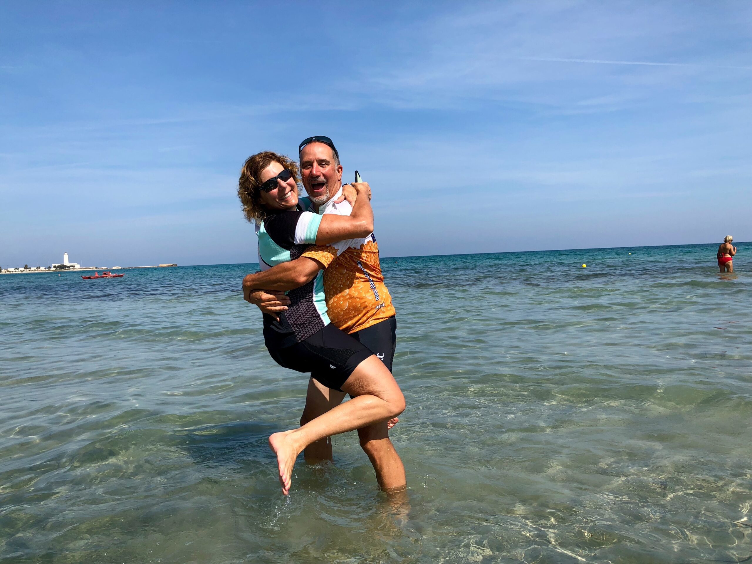 A couple hugs and smiles while in the Adriatic Sea