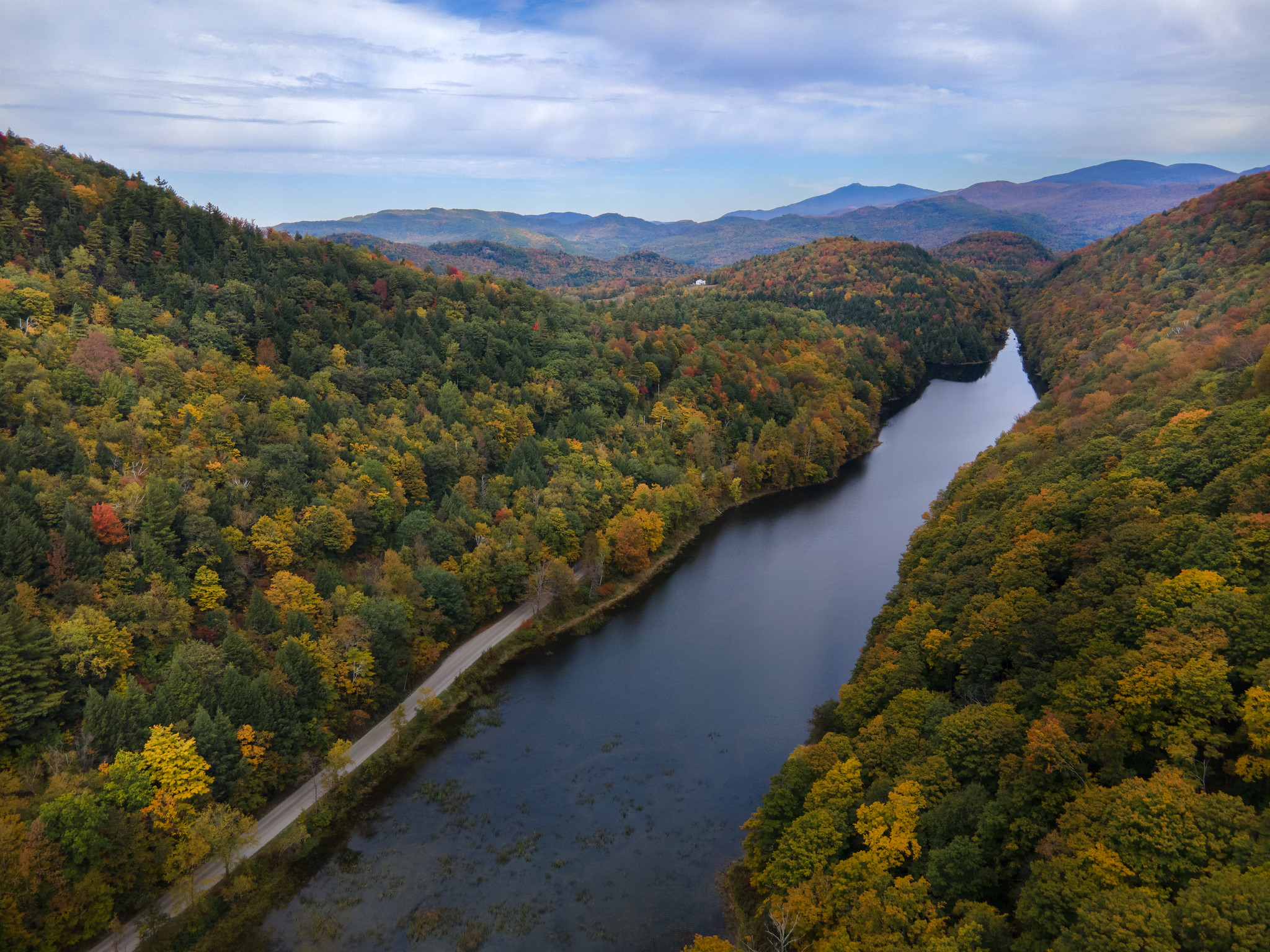 Arial photo of a river with the leaves changing color in Vermont