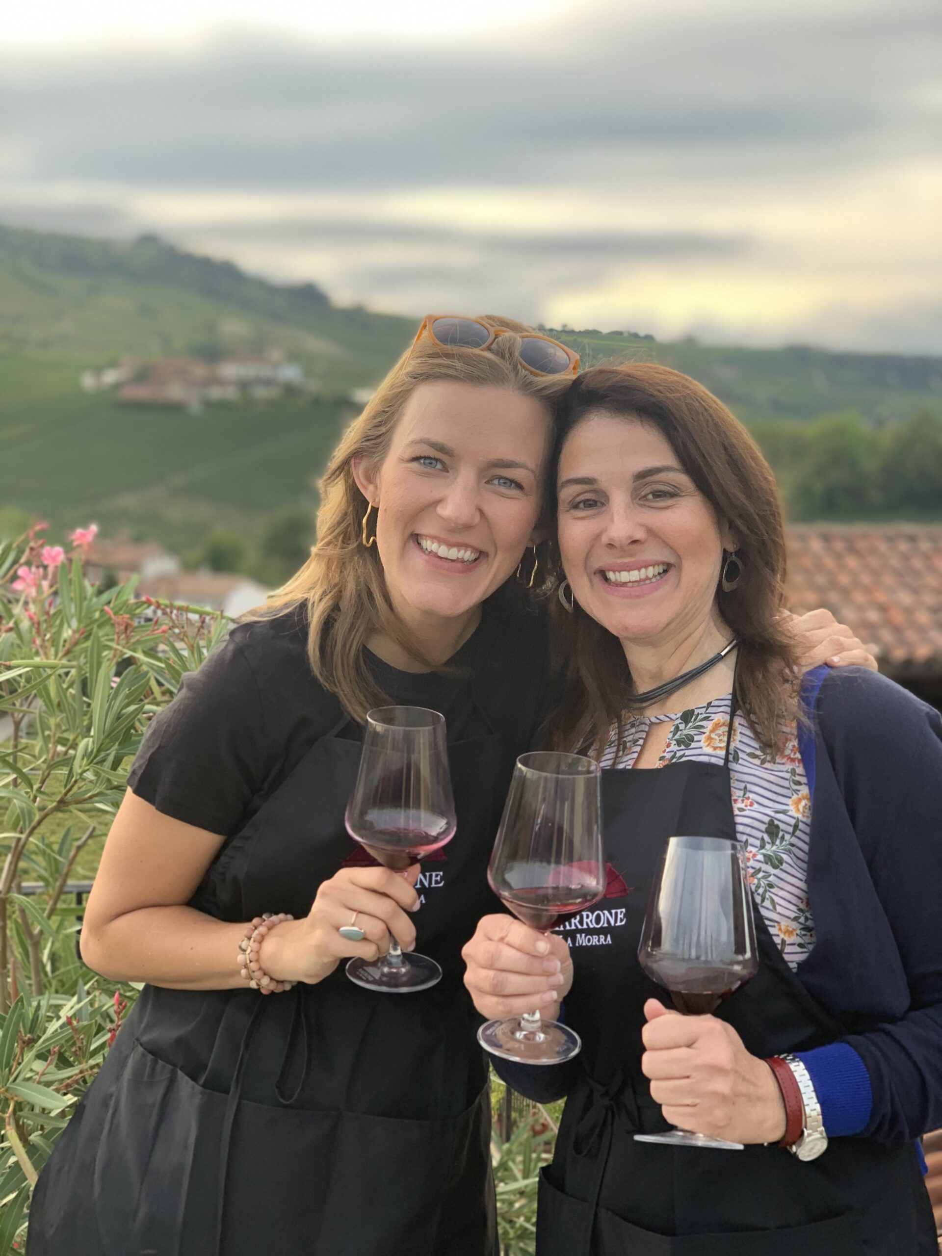 PI:smiling ladies with glass of Barolo