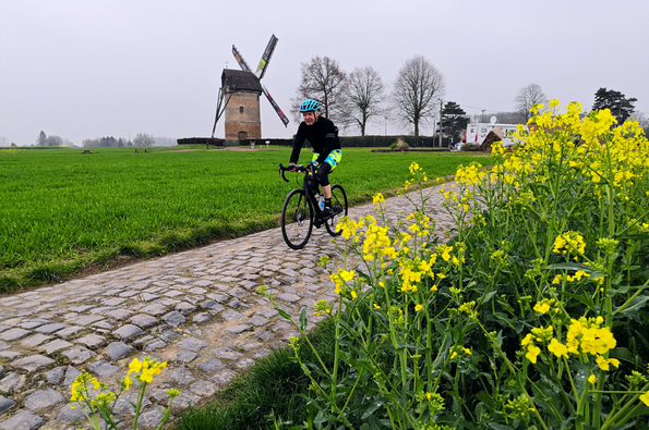 Rider cycling on the cobbles