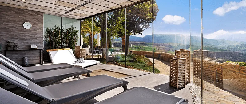 outdoor lounge chairs at the Catalonia Reina Victoria Hotel
