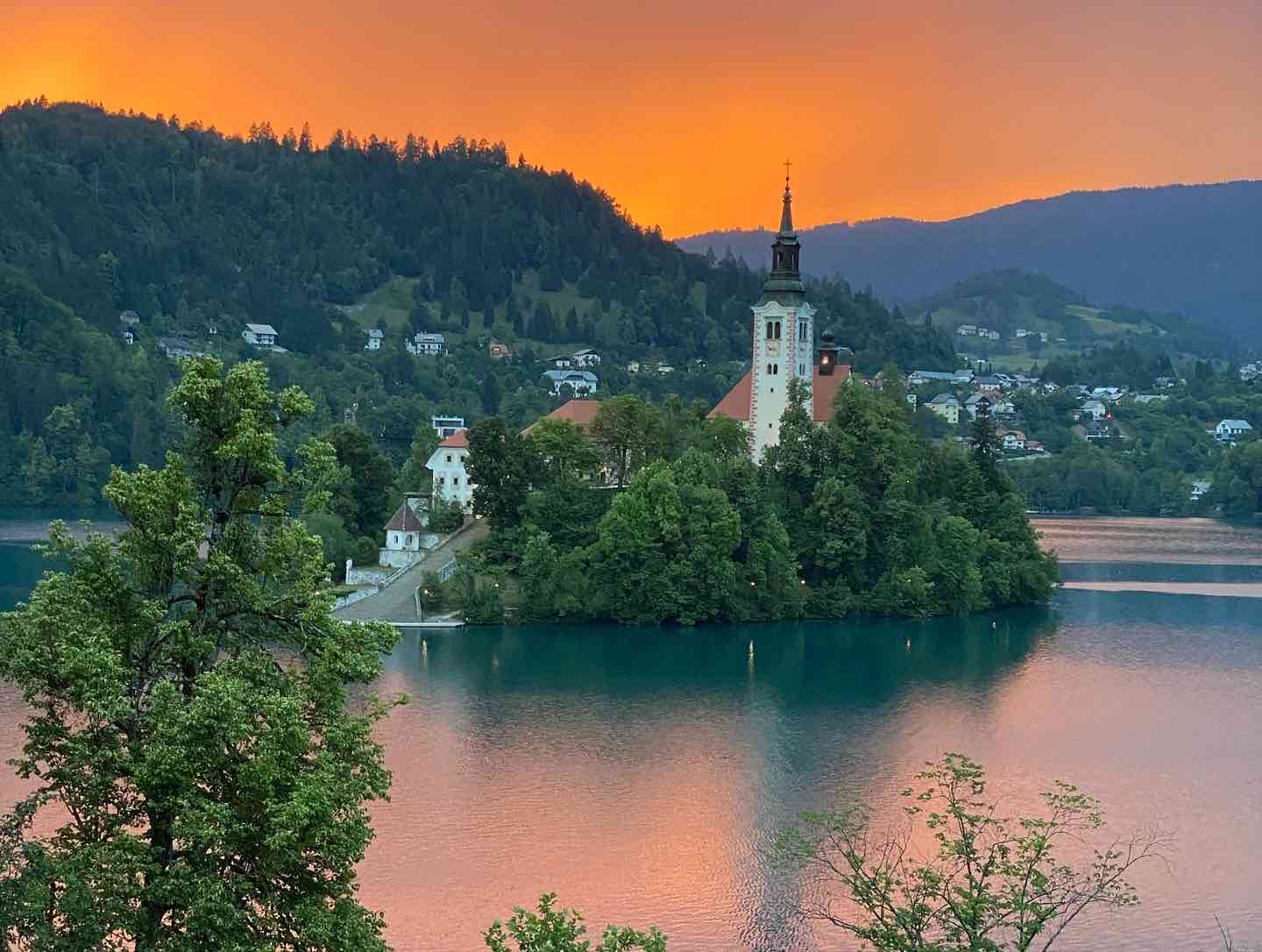 Island on Lake Bled with church before the storm