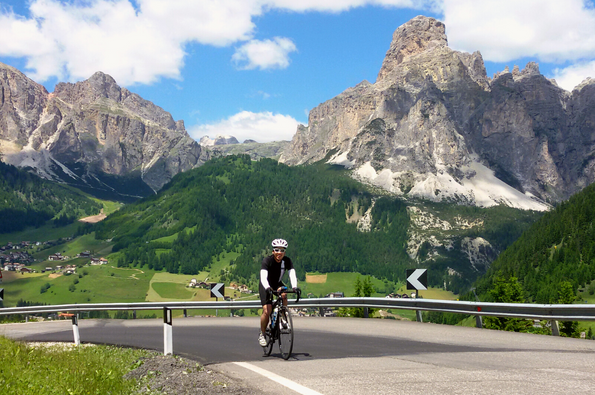 Rider on a climb with mountain in the background