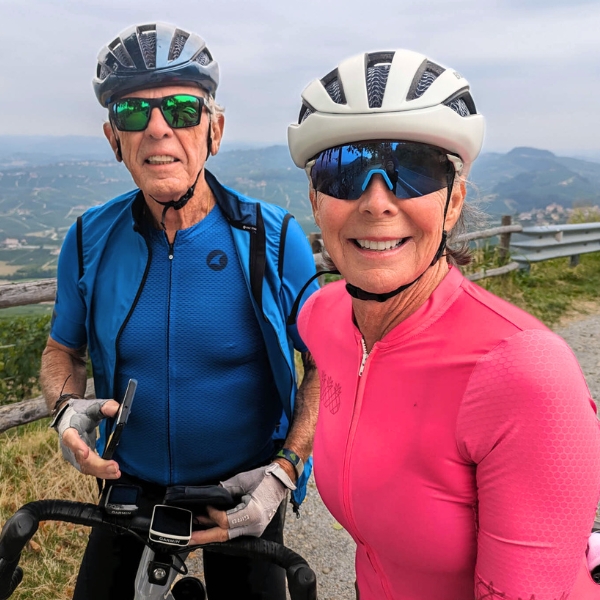 Cyclist couple smiling in front of view