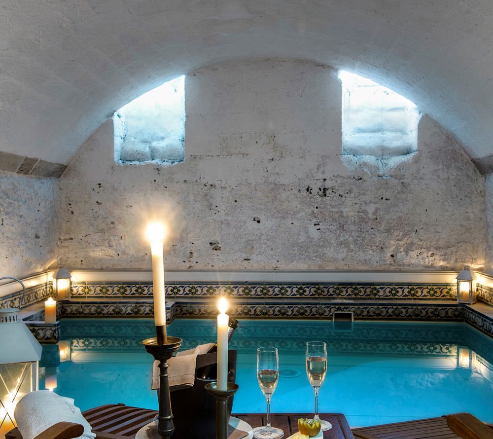 Spa with lit candles and Prosecco in Italy