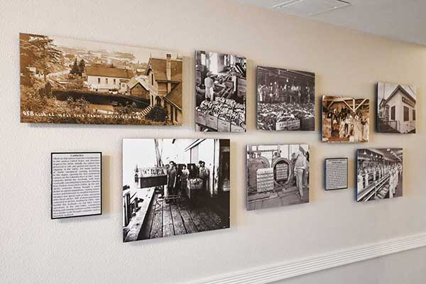 Historic photos of cannery in hallway of Cannery Pier Hotel
