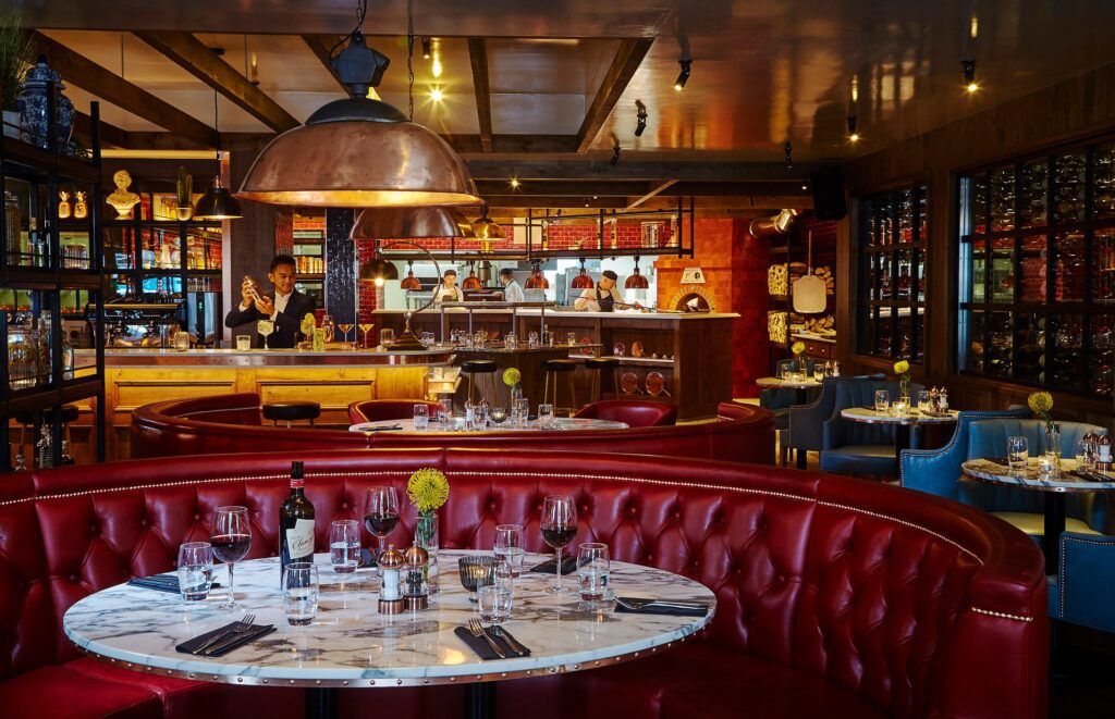 Round table set for dining in a booth in a bar