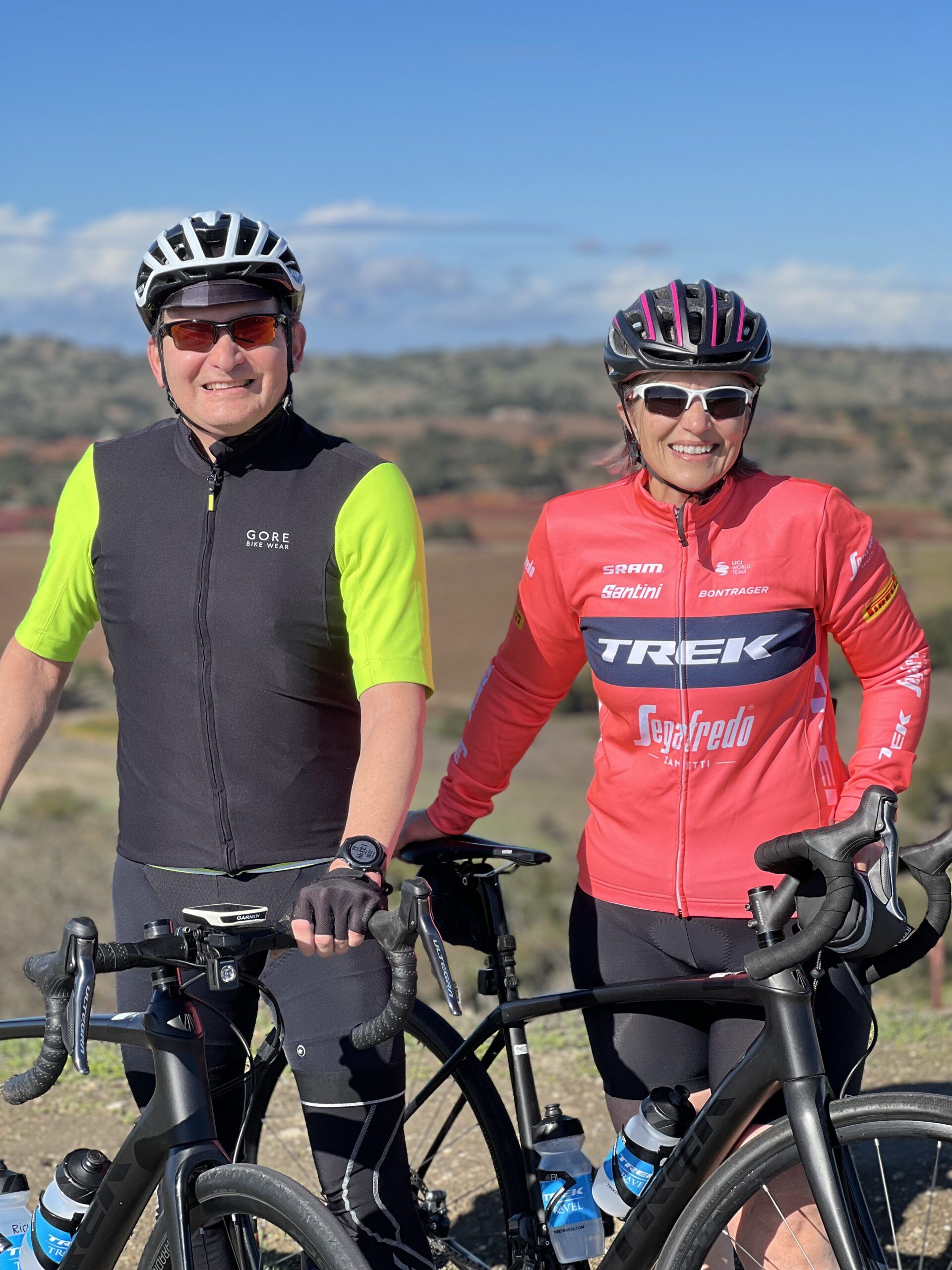 Two cyclists pose for a portrait photo