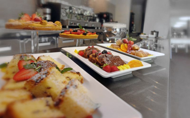 Breakfast buffet with fruit and pastries