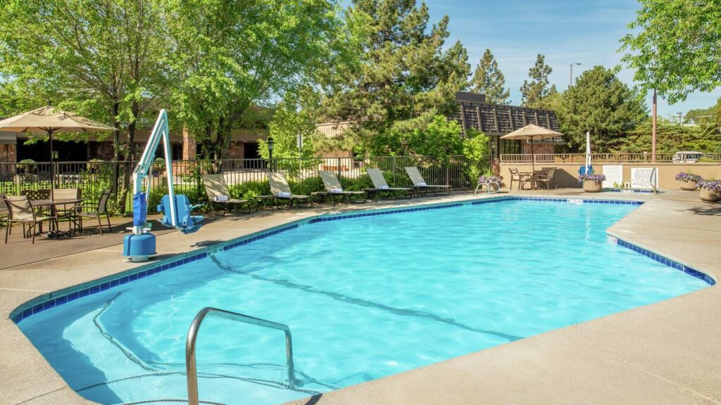 Outdoor swimming pool at Doubletree Missoula on a sunny day