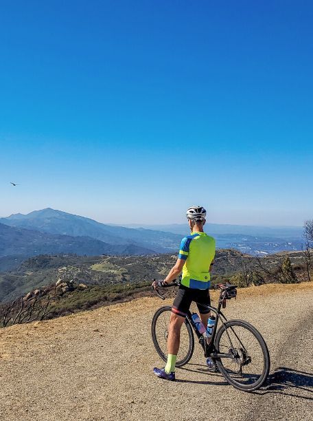 A cyclist at an overlook in California