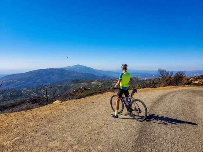 A cyclist at an overlook