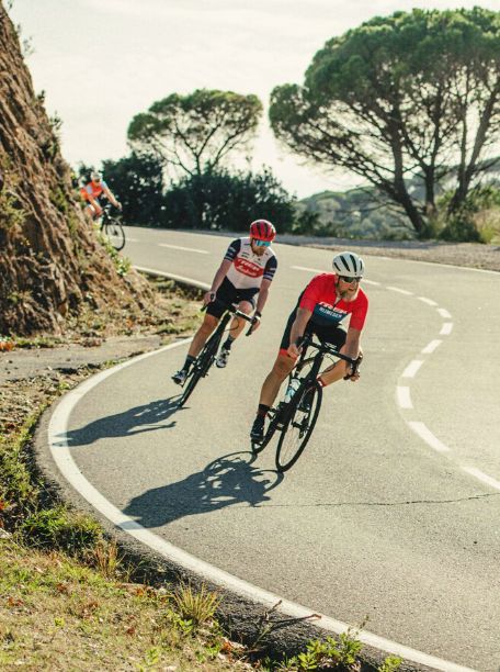 Two cyclists riding in Girona Spain