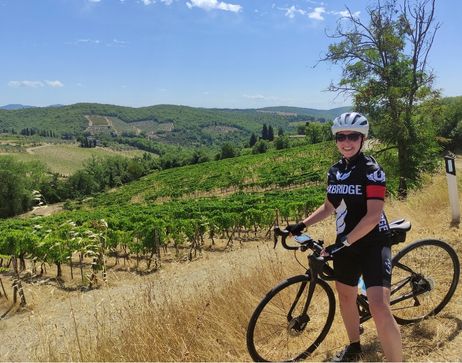A female cyclist in Tuscany, Italy