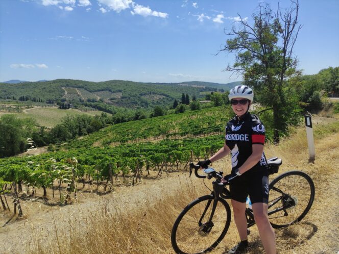 A female cyclist in Tuscany, Italy
