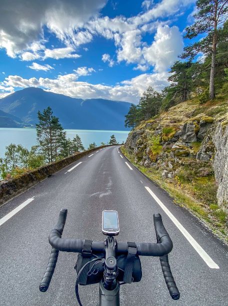 A point of view image of a cyclist on a bike in Norway