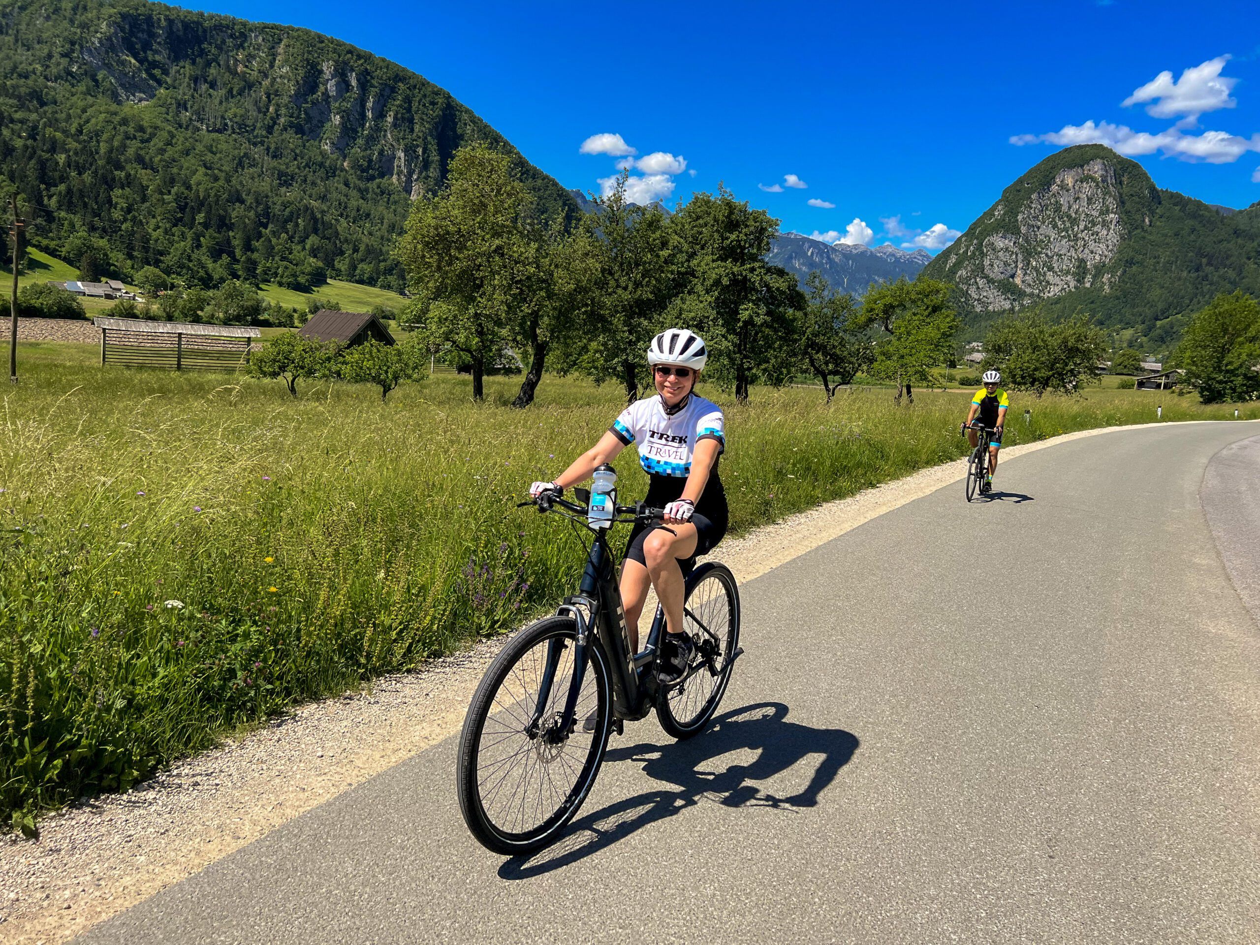 Person riding an e-bike on a paved road in Slovenia