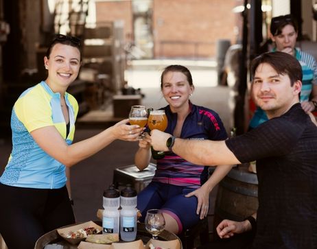 A group of people toasting with a beer in Vermont