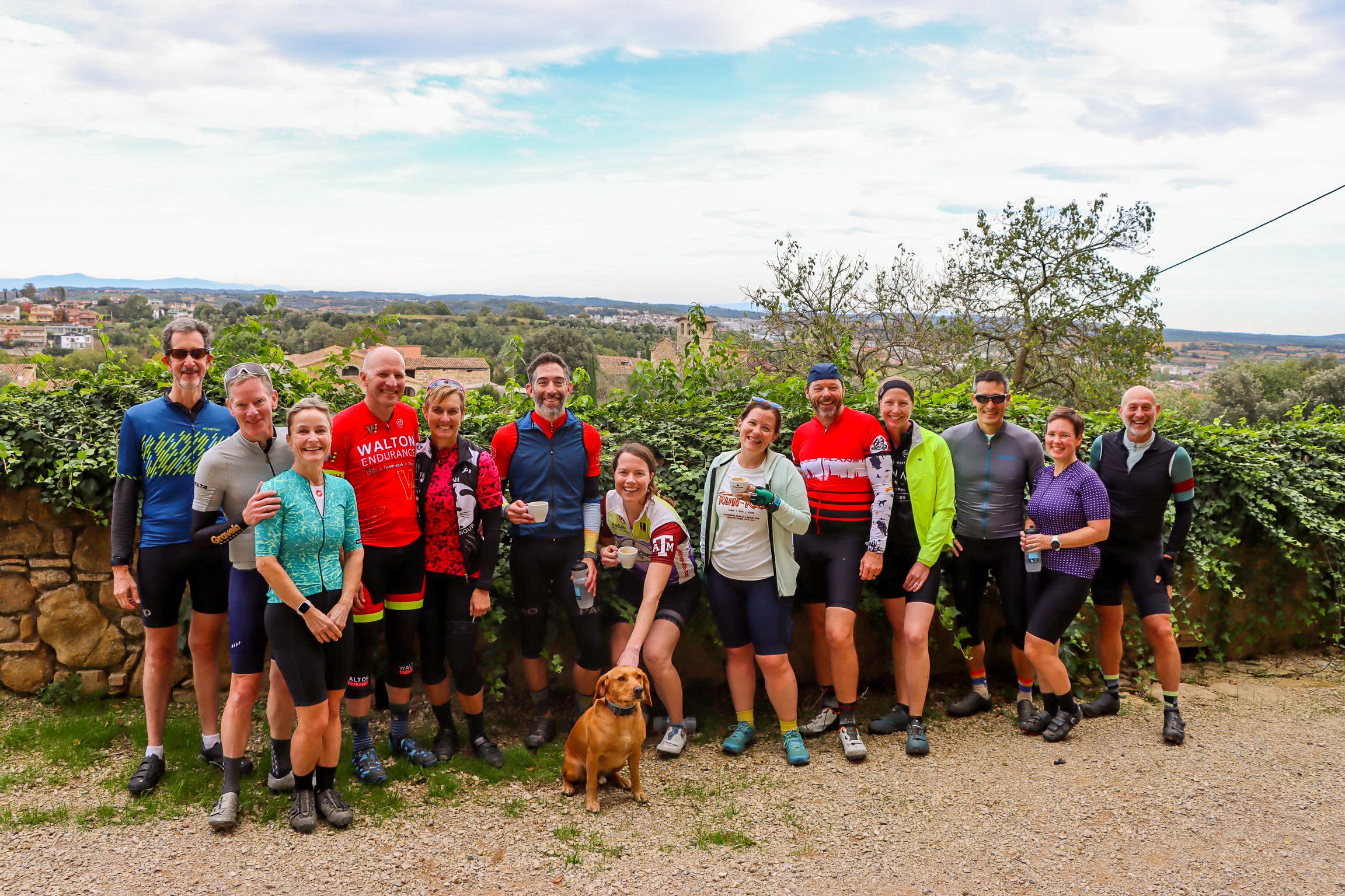 A group of gravel cyclists smiling at the camera in Girona Spain