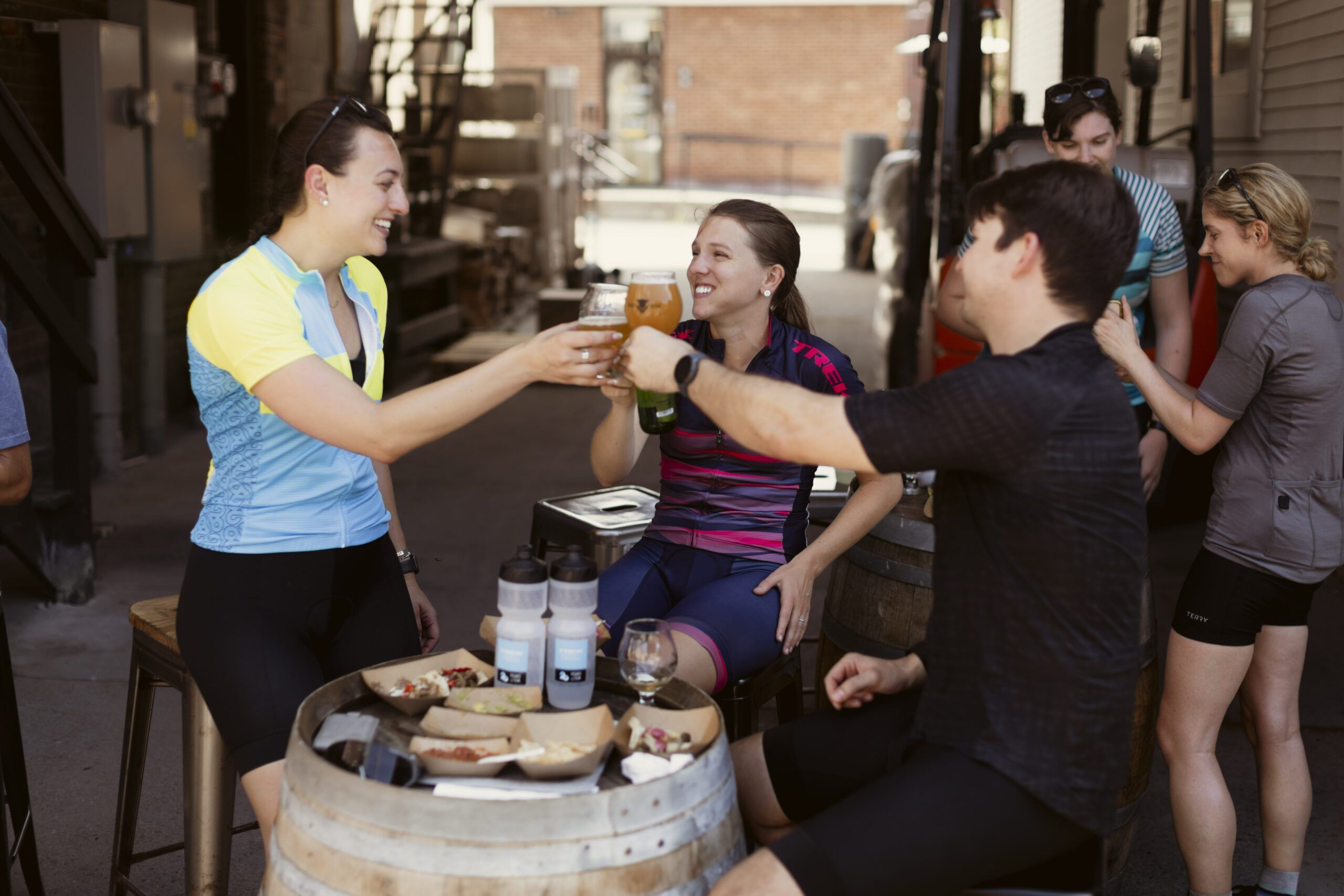 A group of people toasting with a beer in Vermont