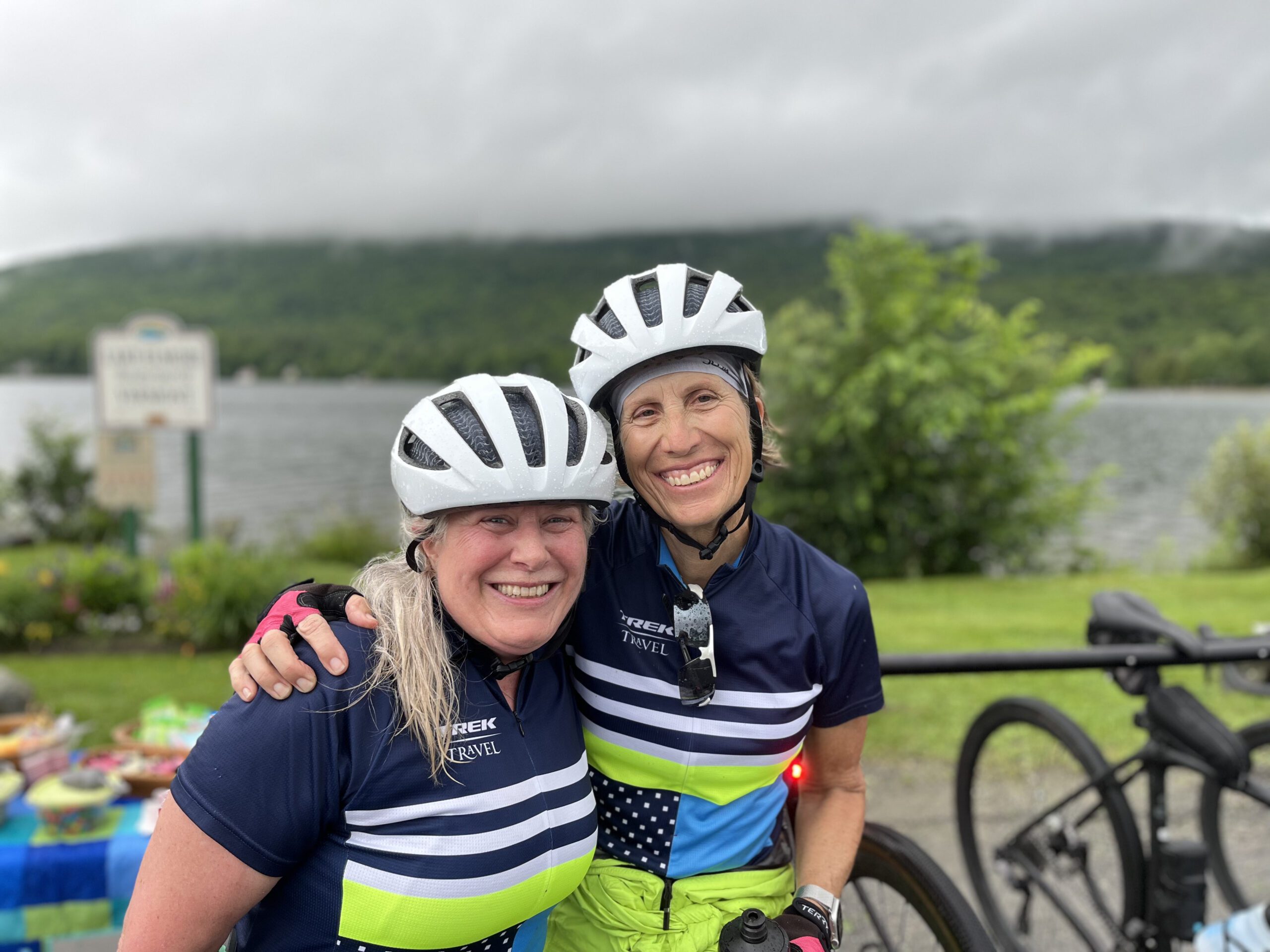 Two women in cycling gear smiling