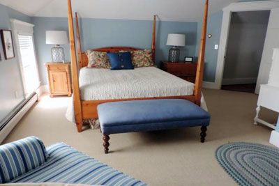 Hotel room with four-poster bed.