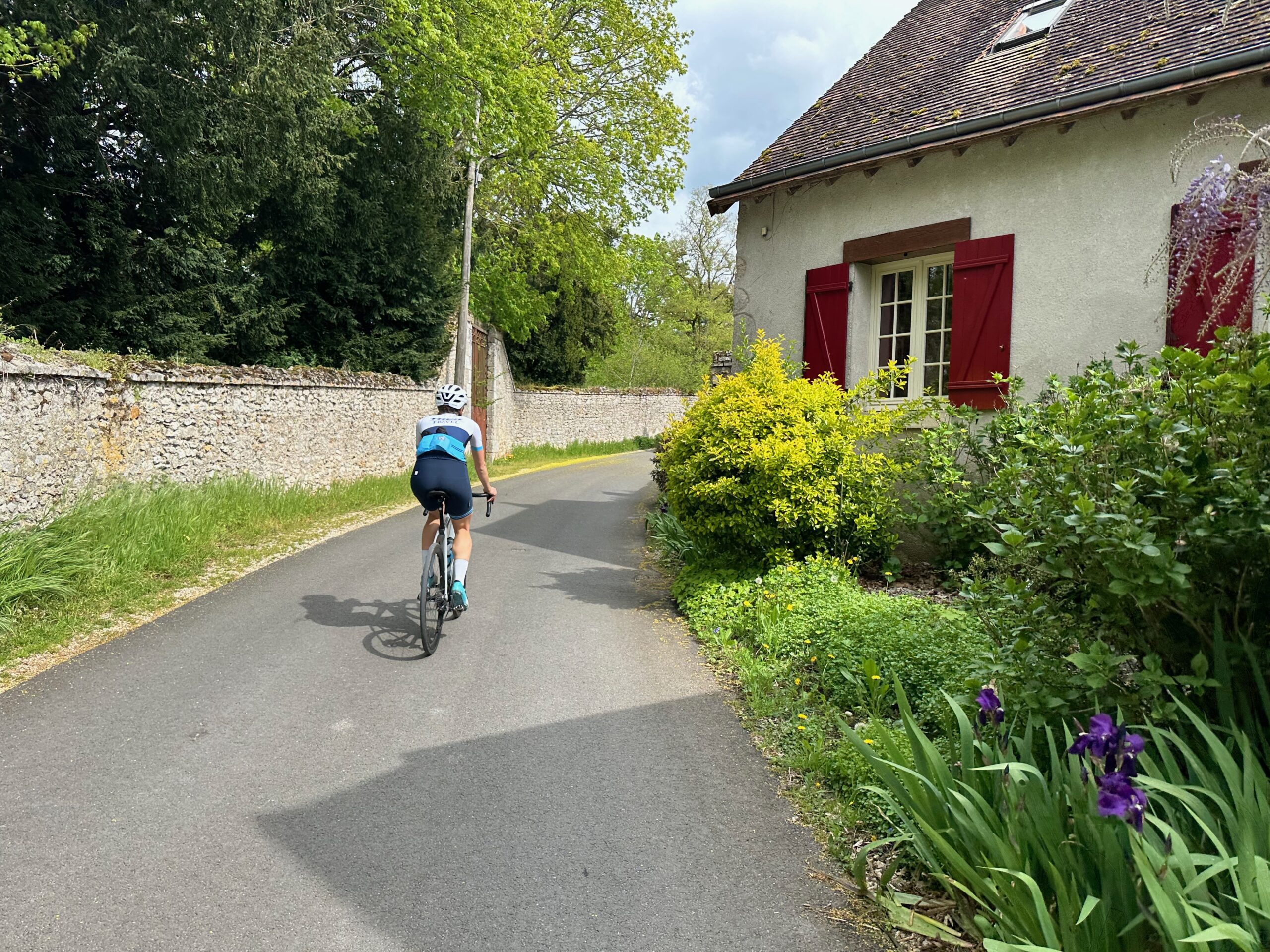 A cyclist riding away in Loire Valley