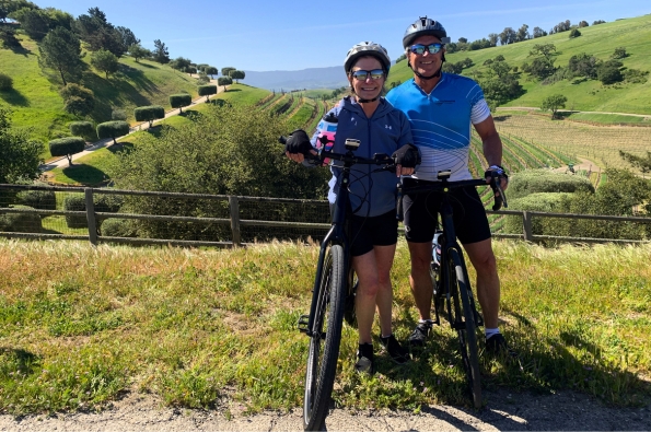 two cyclists standing in the hills of Santa Ynez Valley