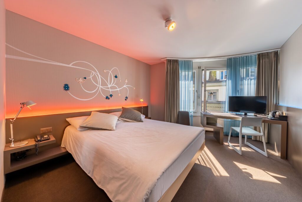 Modern hotel room with double bed