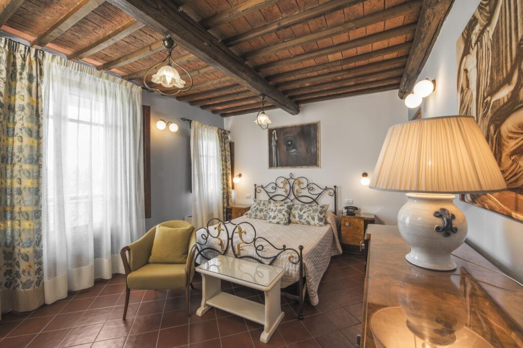 beautiful hotel room with terracotta floor at the Borgo Tre Rose hotel