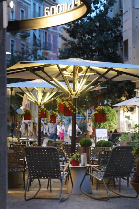 Patio in front of Hotel Ciutat with street scene in background