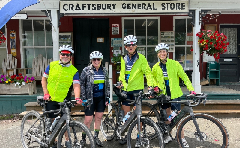 Four cyclists in front of the Craftsbury General Store