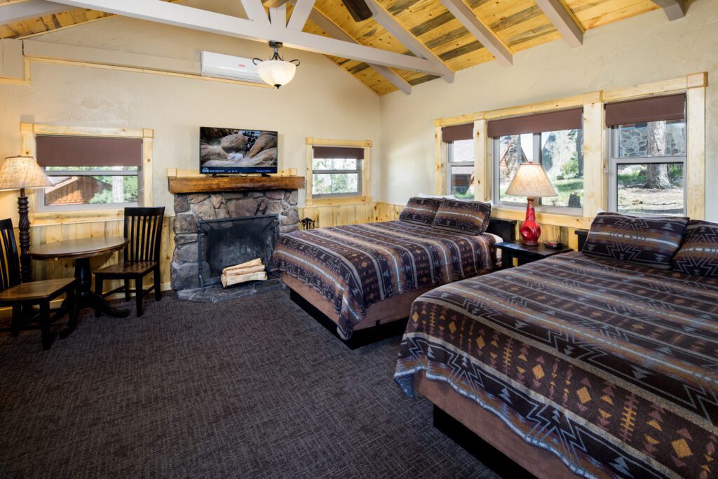 Double bedroom with fireplace at Sylvan Lake Lodge